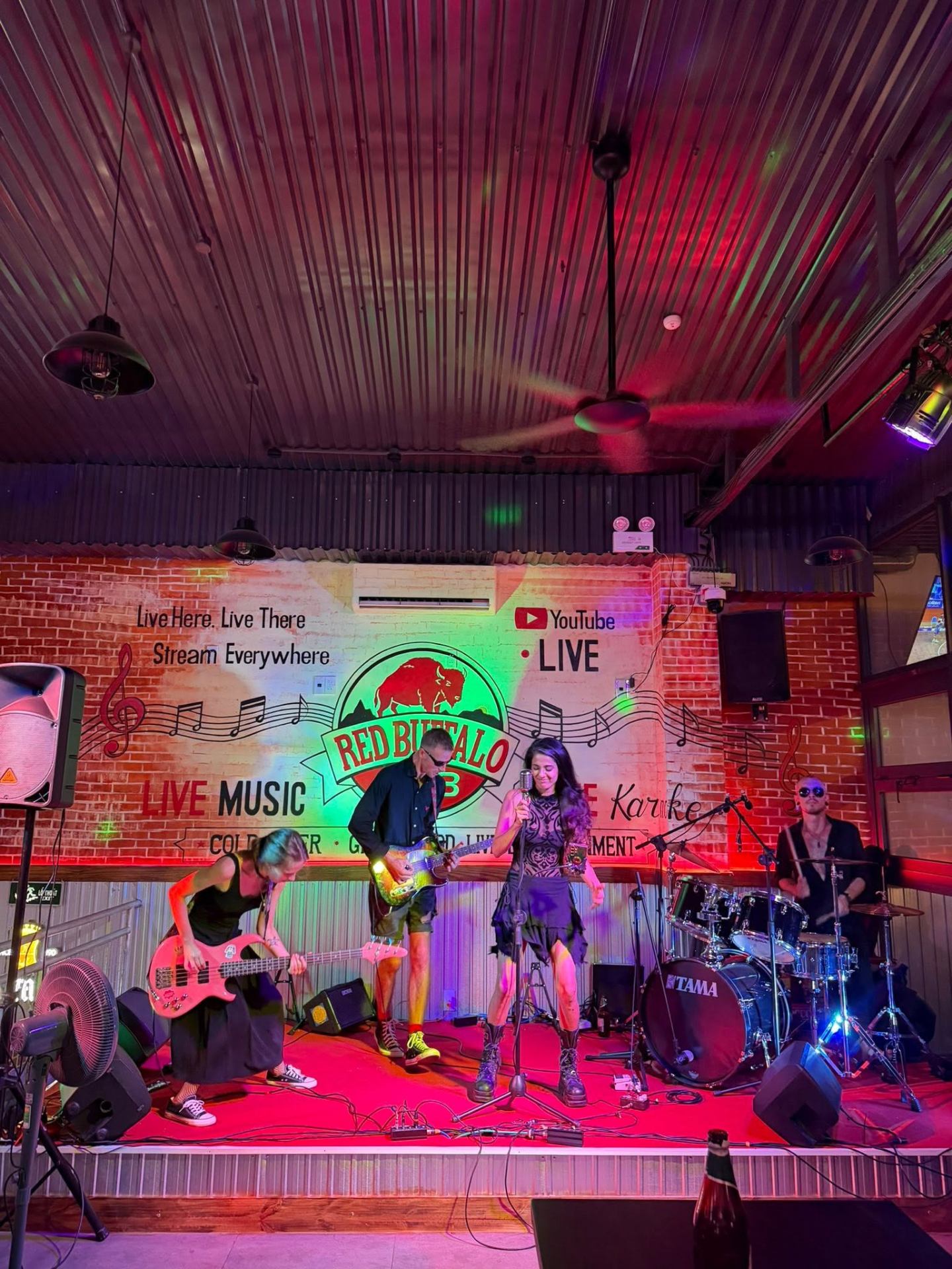 Live band on stage at Red Buffalo Hub