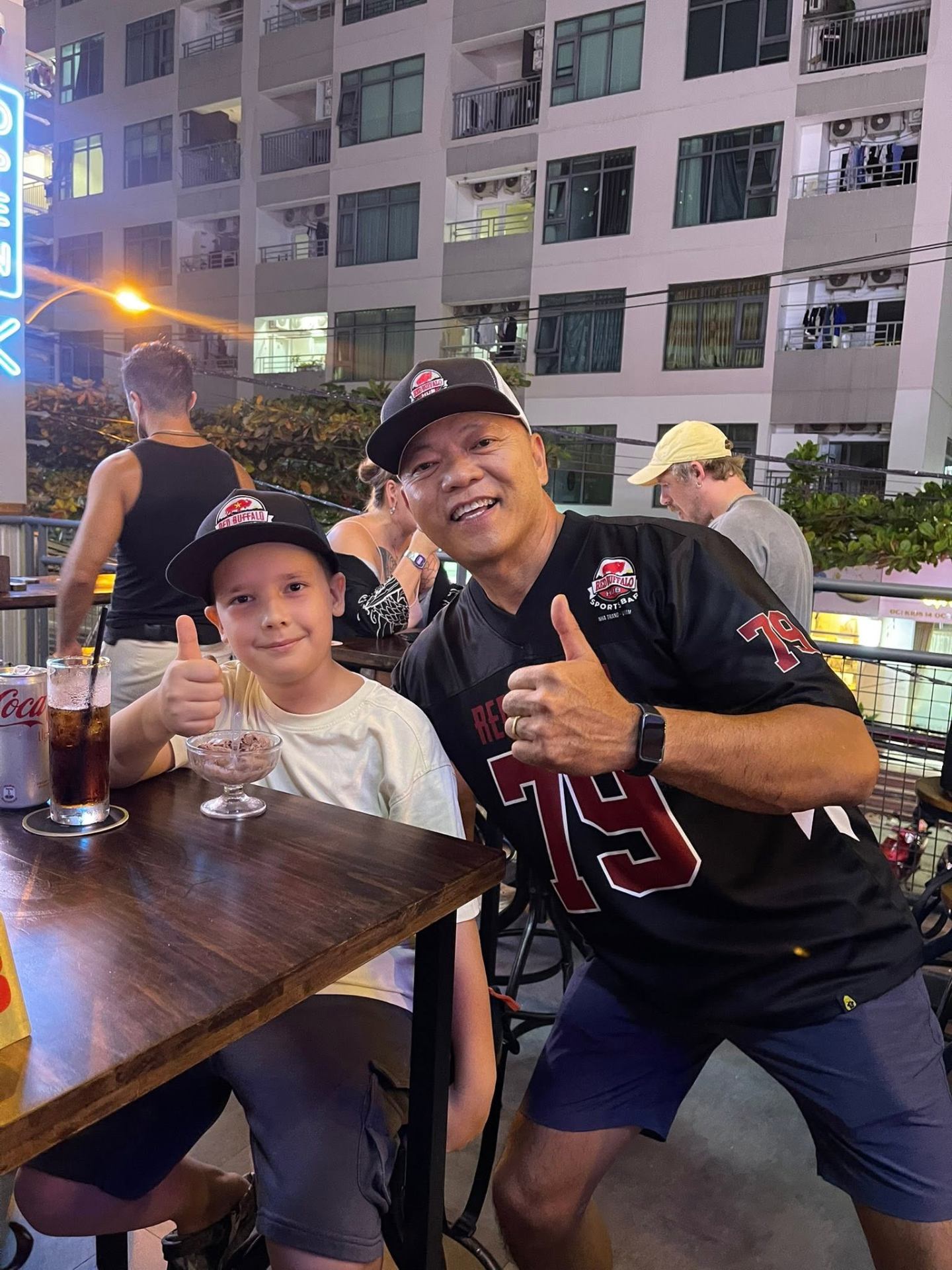 Đức with a happy customer at Red Buffalo Hub